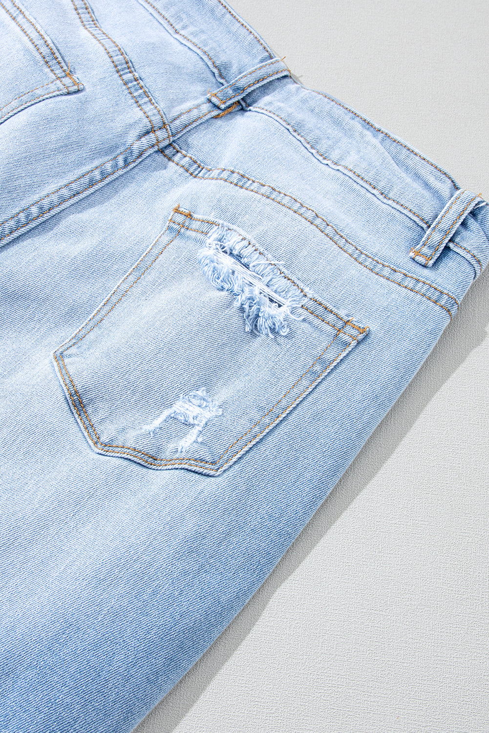 กางเกงยีนส์เอวสูงทำลายสีฟ้าหนัก