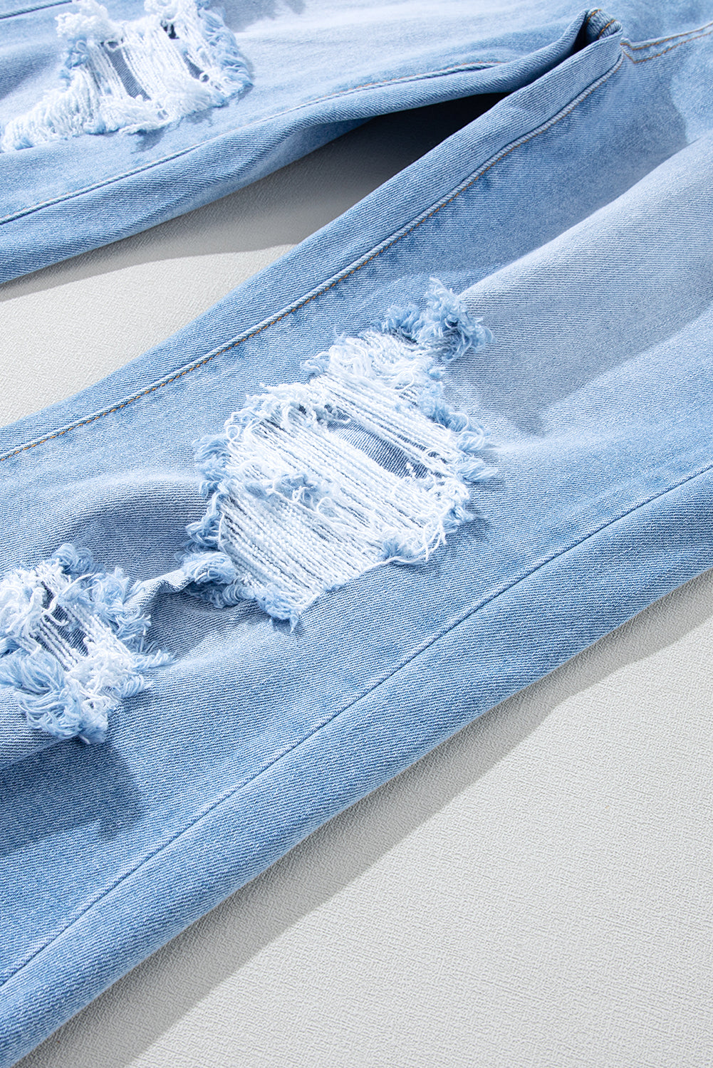 กางเกงยีนส์เอวสูงทำลายสีฟ้าหนัก